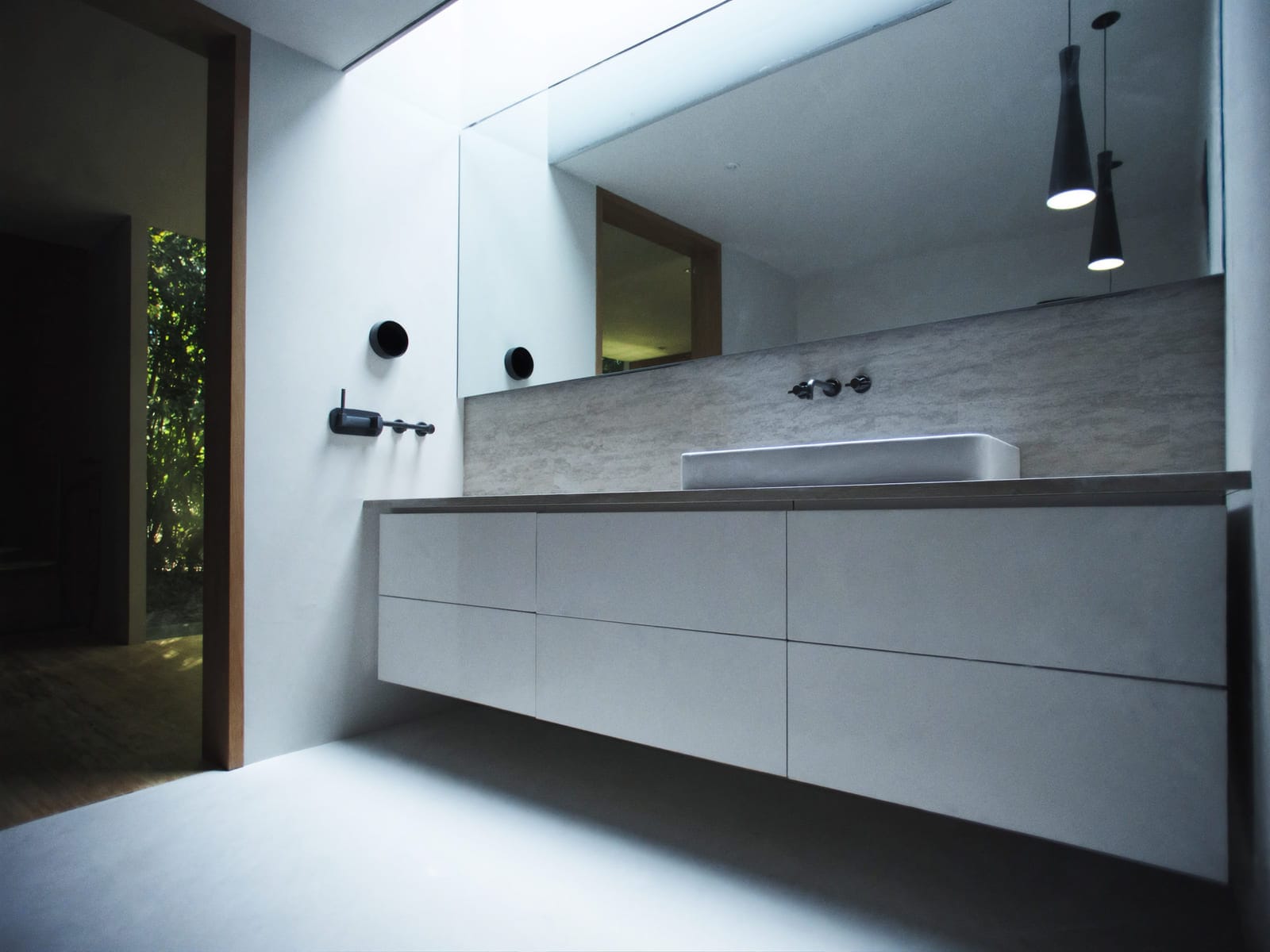 A modern bathroom with a floating vanity unit in a white gloss melamine finish, a rectangular basin on a laminate top, and PVC wall panels behind it. Illustrative concept visual, not a real photograph.